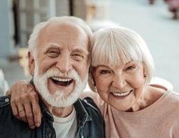 Husband and wife smiling